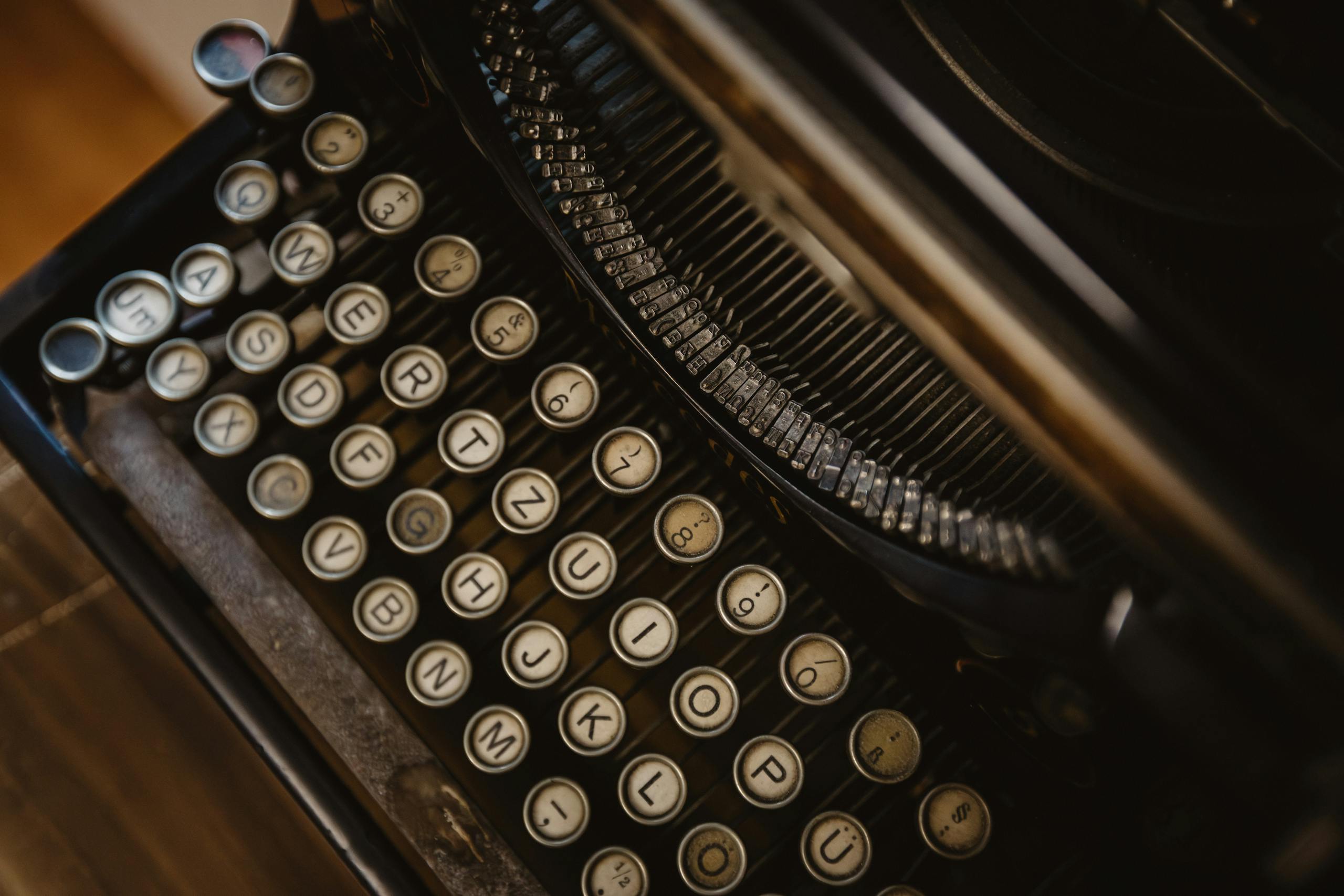 Detailed close-up of vintage typewriter with round keys, showcasing retro design.