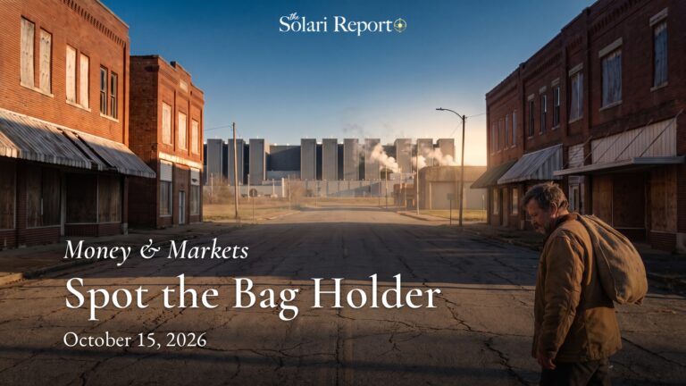 A man in a worn canvas jacket walks head-bowed along an empty small-town main street of boarded-up brick stores, a heavy burlap sack over his shoulder; a huge grey data center with steam plumes closes the end of the street under a deep blue sky. Overlaid text: The Solari Report masthead, Money & Markets, Spot the Bag Holder, October 15, 2026.
